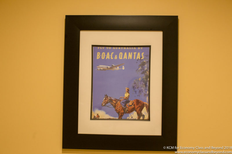 a framed picture of a man riding a horse