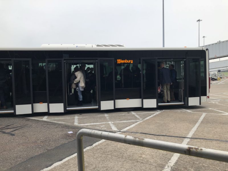 a bus with people boarding