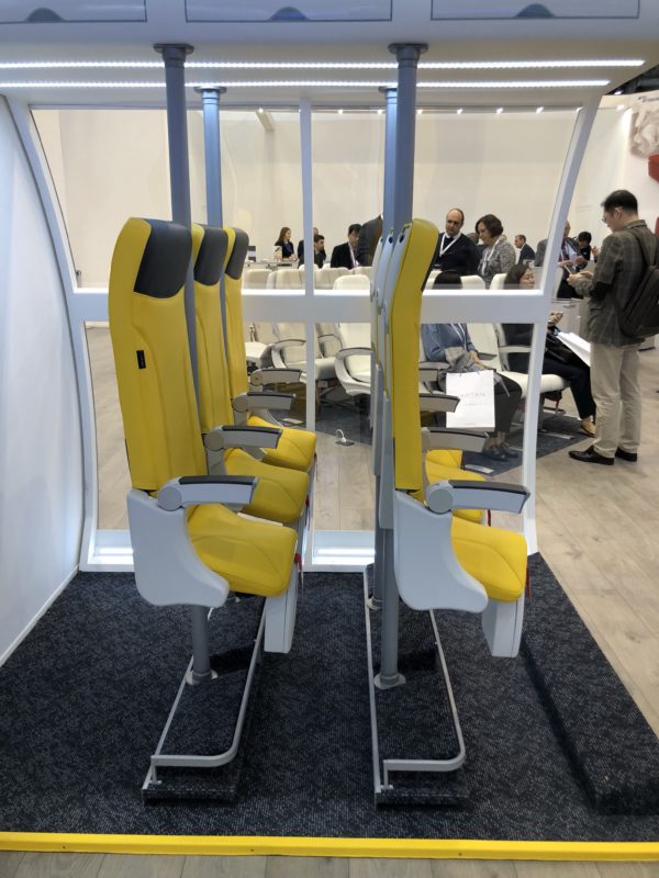 a group of yellow seats in a room
