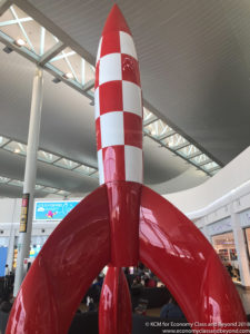 a red and white rocket in a mall