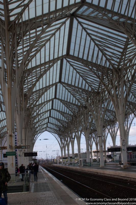 a train station with glass roof