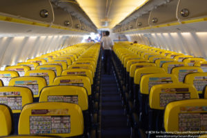 a man walking in an airplane