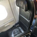 a black seat in an airplane