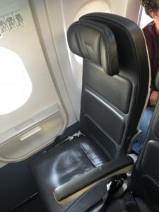 a black seat in an airplane