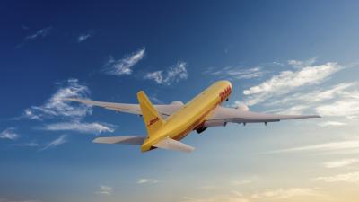 a yellow airplane in the sky