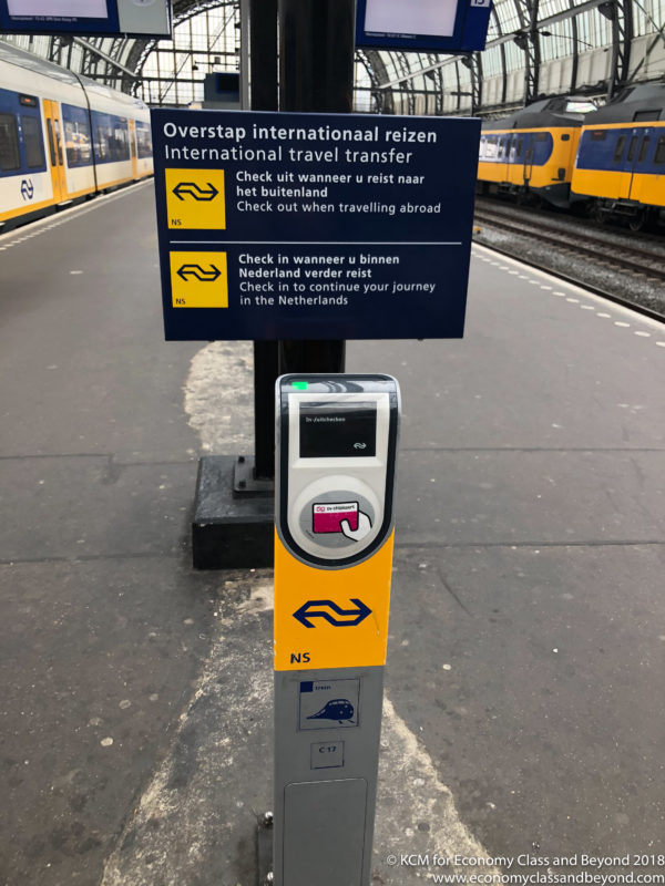 a train station with a ticket machine