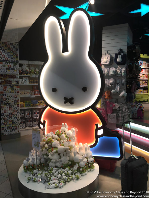 a large lit up rabbit figure in a store