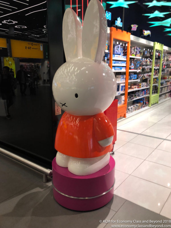 a large white rabbit statue in a store