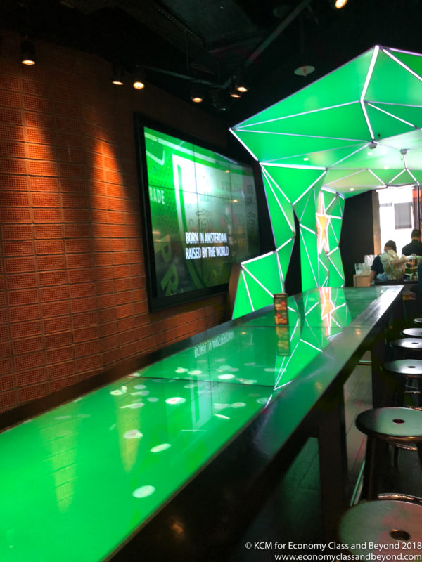 a bar with green lights