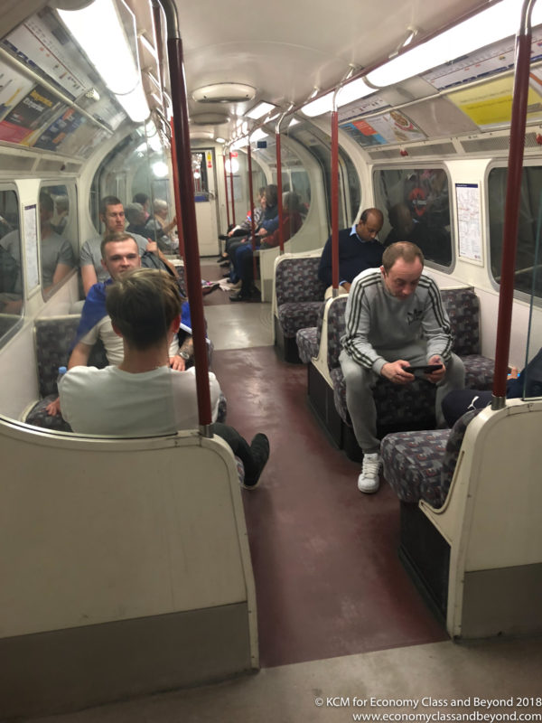 a group of people sitting on a train