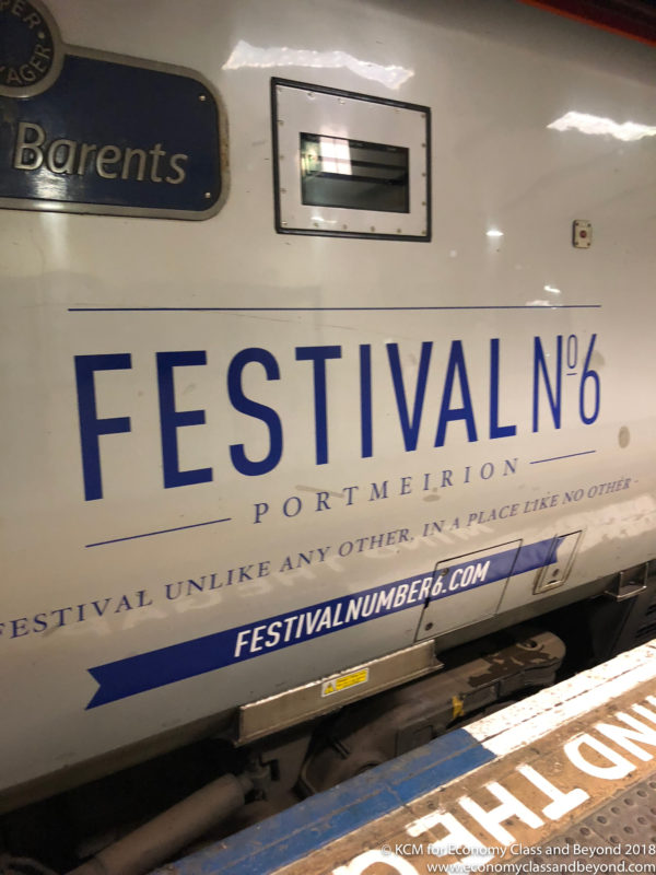 a white train with blue writing on it
