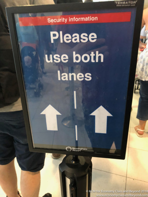 a sign with white text and arrows on it