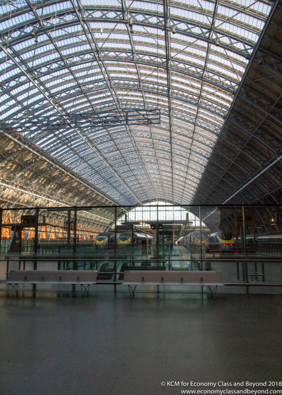 a train station with a glass roof