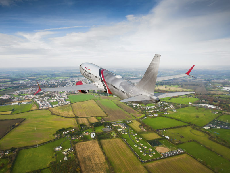 an airplane flying over a city