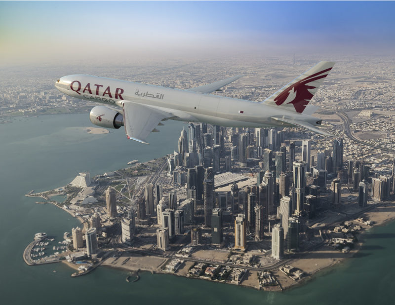 an airplane flying over a city