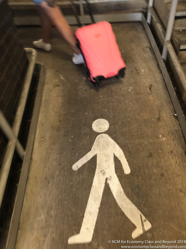 a person with luggage on the ground
