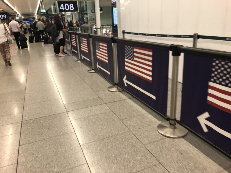 a row of flags in a airport