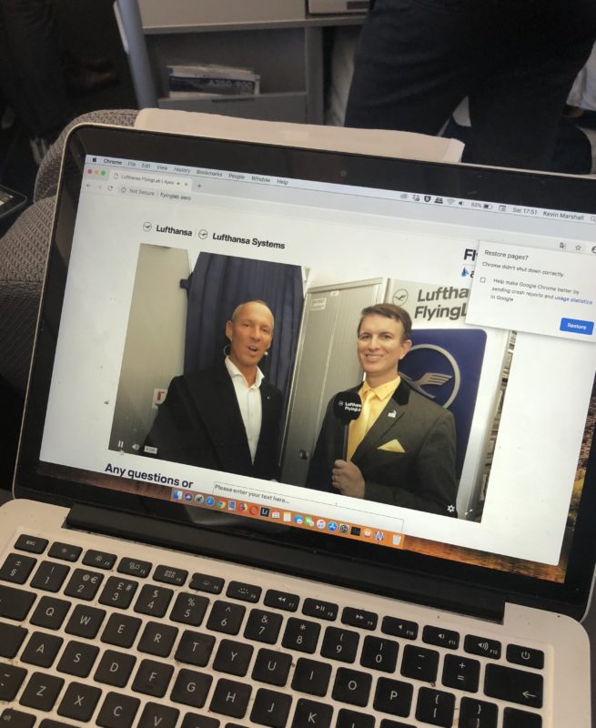 a laptop with a picture of two men