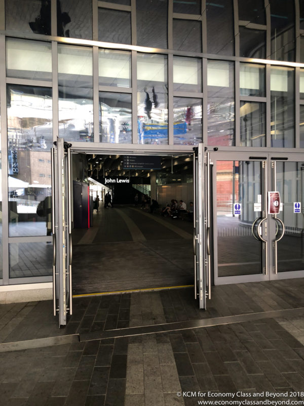 a glass doors with a large entrance