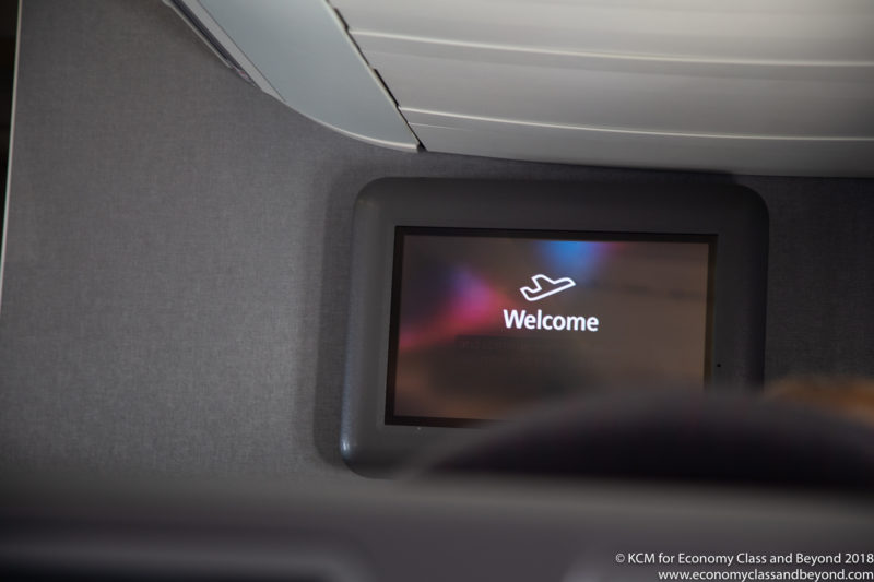 a screen on the floor of an airplane