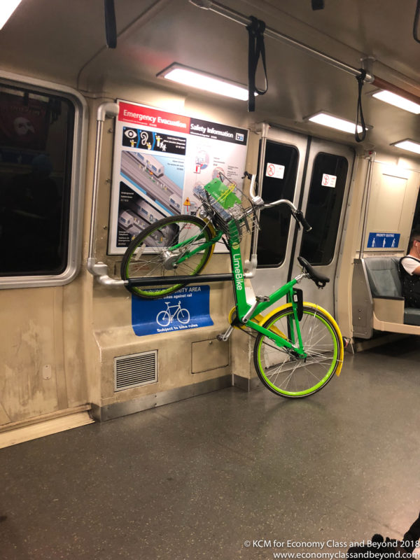 a green bicycle on a subway car