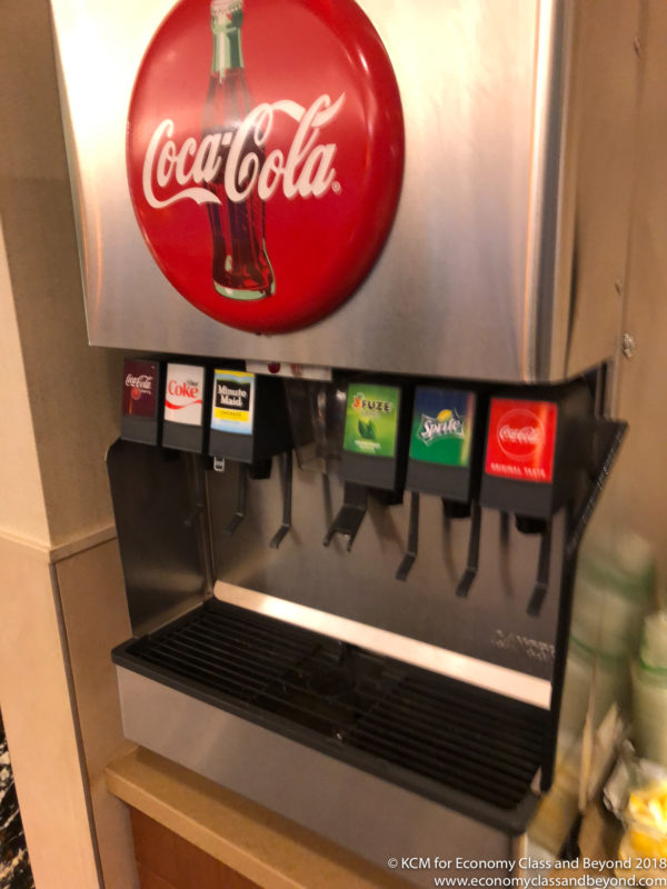 a soda machine with a red circle on it