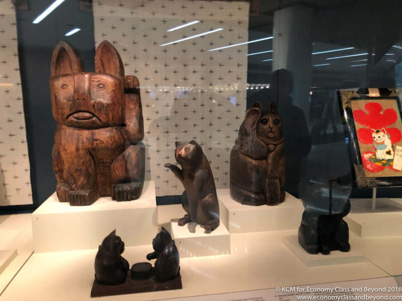 a group of wooden sculptures on display