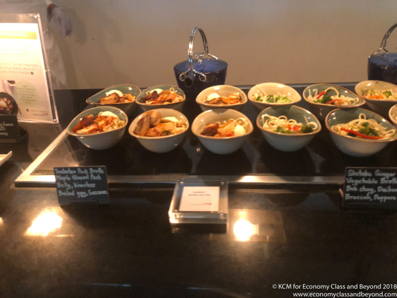 a row of bowls of food