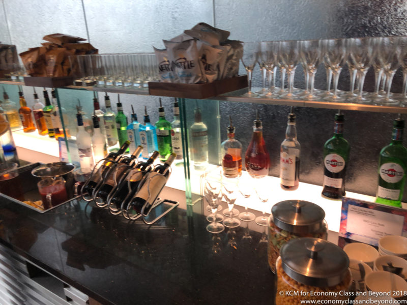 a bar with bottles and glasses