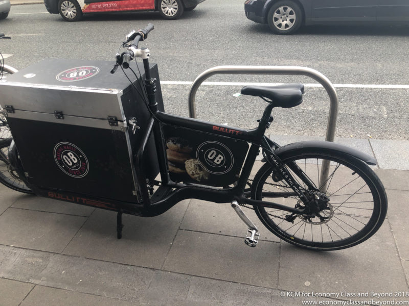 a bicycle with a box on the side of it