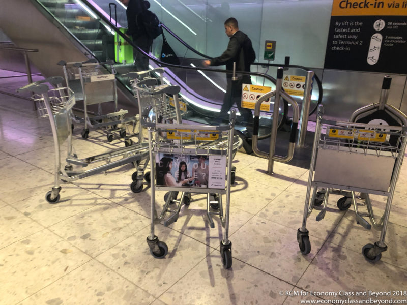 luggage carts on a escalator