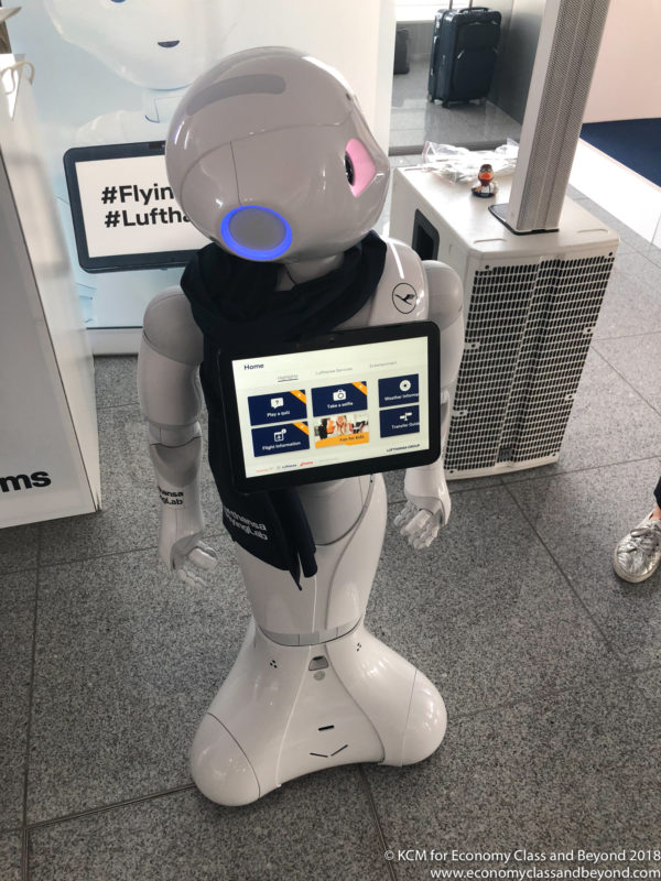 a robot holding a tablet