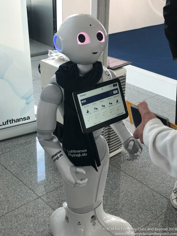 a robot holding a tablet