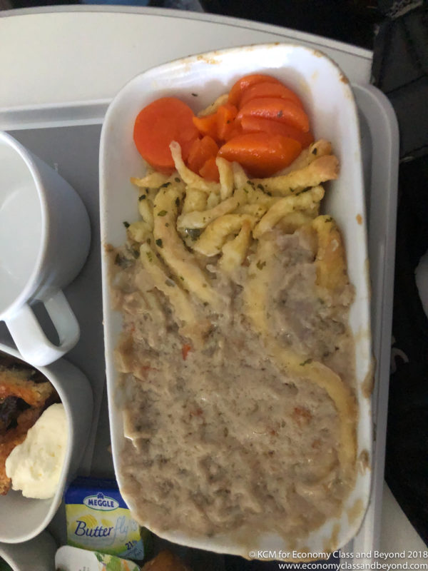 a white rectangular container with food in it