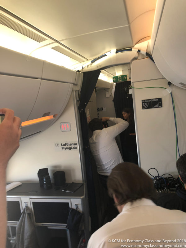 people in an airplane with people in the back