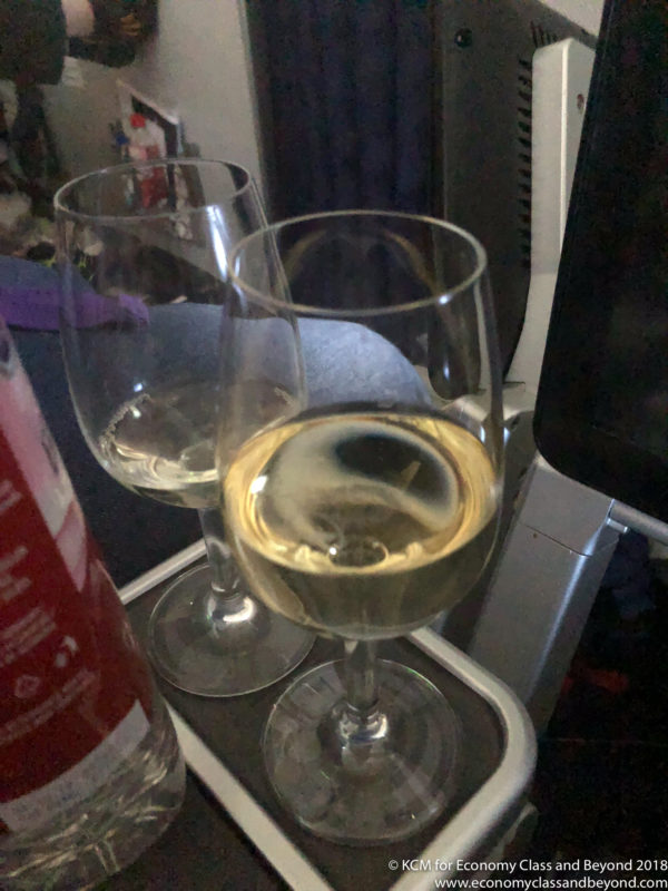 two glasses of wine on a tray