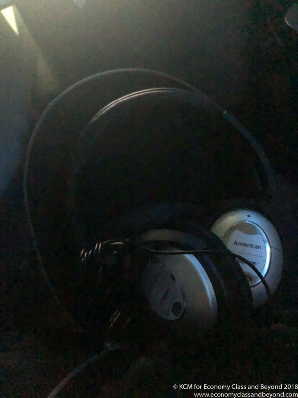 a pair of headphones on a black surface