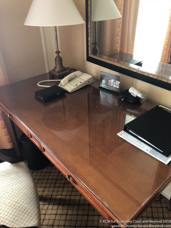 a desk with a phone and a phone on it