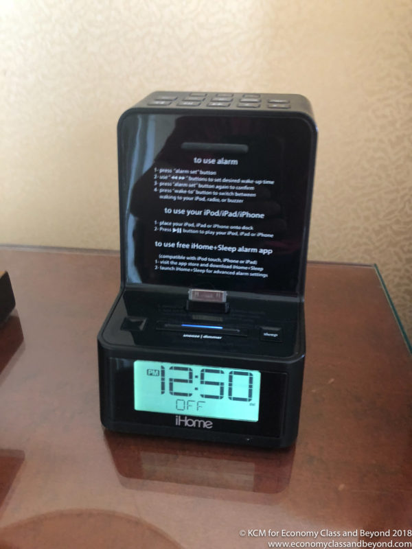 a black alarm clock with a screen