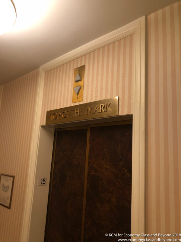a elevator with a sign above it