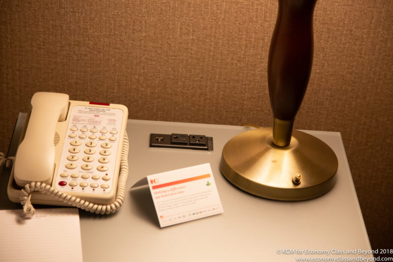 a telephone and a lamp on a desk