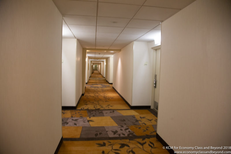 a long hallway with carpeted floor