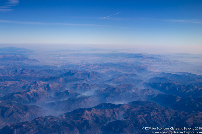 a view of mountains from an airplane