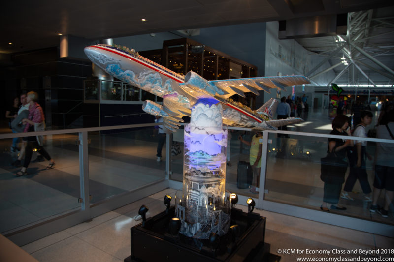 a model airplane on a pedestal in a building