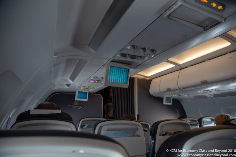 an airplane with seats and a screen