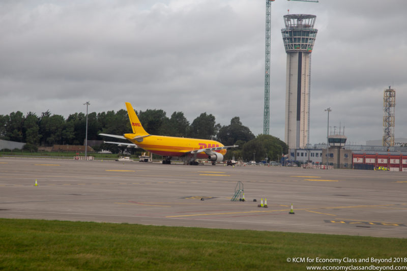 a yellow airplane on a runway