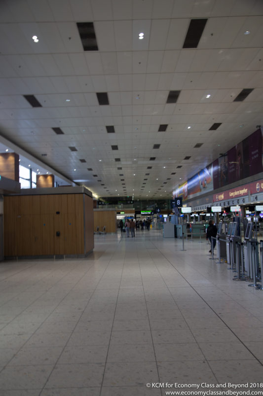 a large airport with people walking around