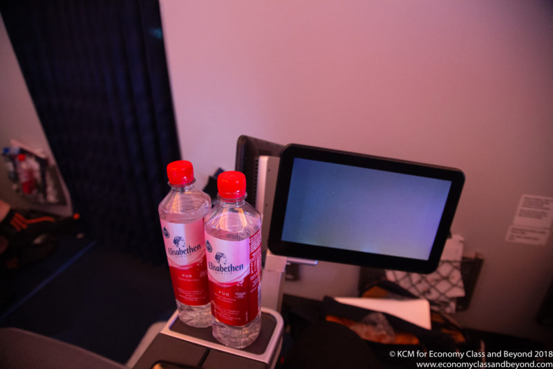 two bottles of water on a computer