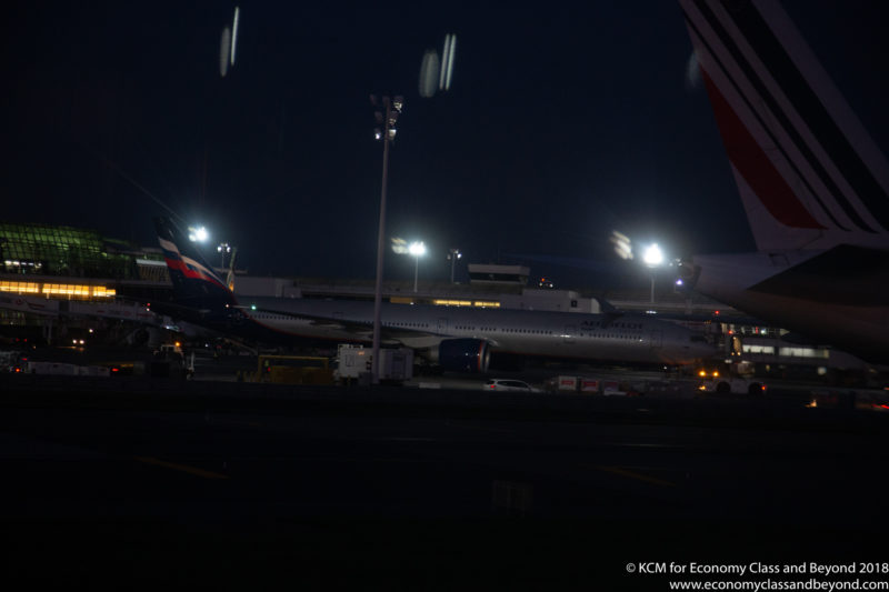 a plane at an airport at night