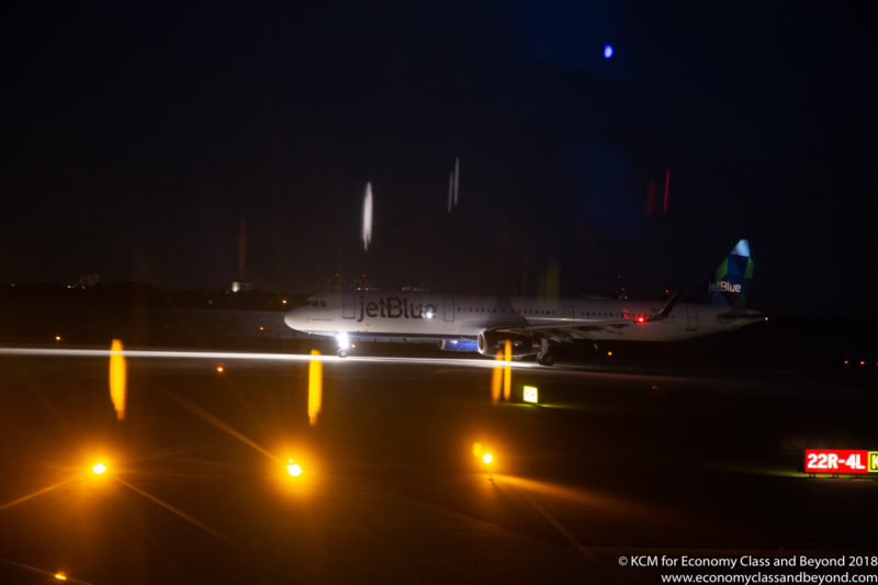 a jet plane on a runway at night